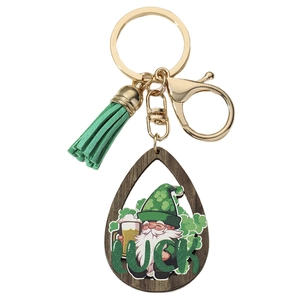 Detail of St. Patrick's Day keychain with green tassel and Luck gnome wood pendant