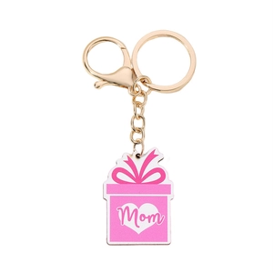 Detail of pink gift box charm with Mom lettering and golden clasp for Mothers Day keychain