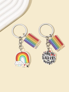 Macro detail of acrylic teacher keychains with rainbow pencil and motivational quotes
