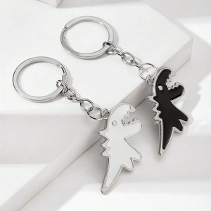 Set di portachiavi a forma di dinosauro bianco e nero in metallo per coppie e accessori