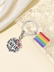Close-up of acrylic teacher keychain with rainbow pencils and inspirational slogan
