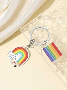 Macro detail of acrylic Teacher Aide keychain with rainbow pencil heart and metal ring