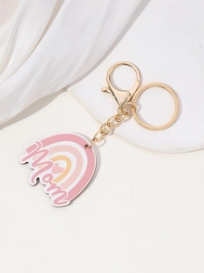 Detail of a golden Mom keychain with a rainbow pendant and lobster clasp for Mother's Day