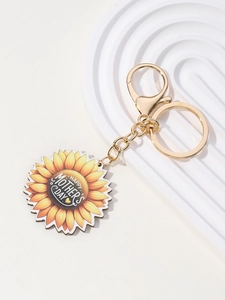 Detailed macro view of Mother's Day keychain featuring sunflower and happy mother's day text