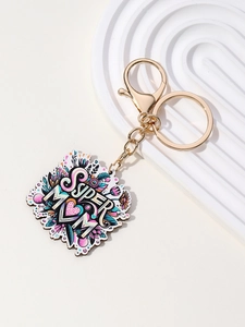 Detailed view of Super Mom keychain with golden lobster clasp and floral pattern charm