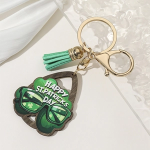 Green St. Patrick's Day keychain with clover wooden pendant and leather tassel charm