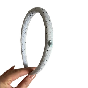 Polka dot fabric headband with padded design and handmade label for daily hair styling