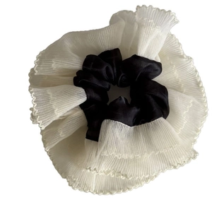 Elegant black satin and white lace tiered scrunchie with a pleated ruffle design