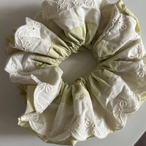 Detail of Korean style double-layered lace scrunchie with green embroidery in fresh style