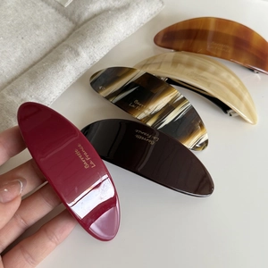 Fermagli ovali in acetato stile francese in cinque colori con scritta Barrette La France