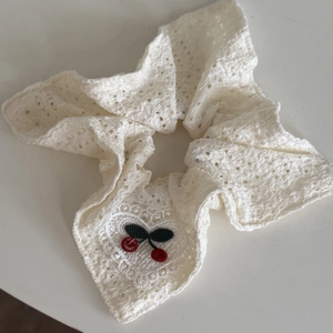 Sweet white lace scrunchie with detailed red cherry embroidery for elegant hairstyles