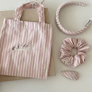 Pink striped hair accessory set including headband, scrunchie and bow clip in fabric