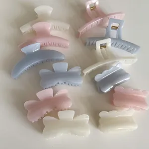Elegant jelly-colored hair claw clips in blue, white, and pink set for women