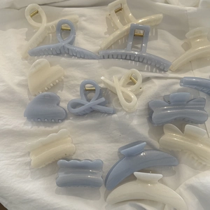 Elegant blue and pearl white glitter jelly hair clips in various geometric shapes