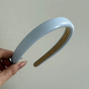 Light blue glossy padded headband with non-slip suede lining for vintage hair styling