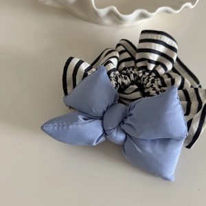 Blue matte satin bow scrunchie with classic black and white stripes for hair styling