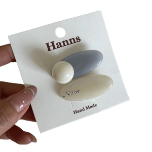 Pastel blue and white oval hair clip set with 3D sphere and Nuance script text detail