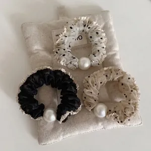 Three-piece organza hair scrunchies set with polka dots, ruffles and white faux pearls
