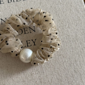 Beige polka dot mesh scrunchie with lace ruffle and large white pearl accent