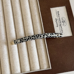 Handmade leopard print acetate hair clip with gold metal spring clip in jewelry box