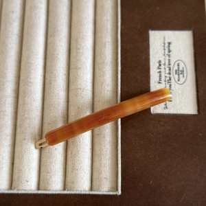 Vintage amber acetate duckbill hair clip with marble texture and gold Paris imprint