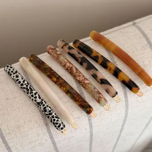 Set of 7 vintage acetate hair clips in assorted marble patterns and leopard prints