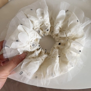 Oversized cream lace scrunchie with black polka dots and delicate floral embroidery