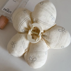 Floral knit fabric flower hair claw clip with bow details and golden spring mechanism