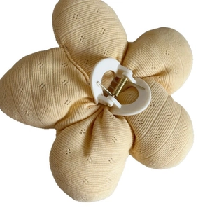 Floral yellow knit flower hair claw clip with heart-shaped grip and metal spring
