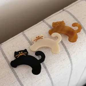 Cute acetate cat hair clips in black, cream and amber finish for girls and women