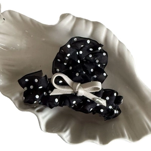 Polka dot chiffon bow hair claw with elegant pearl and silver Love plate on ceramic tray