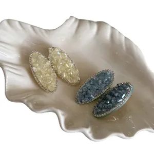 Barrettes ovales élégantes en cristal avec strass brillants en tons jaune et bleu clair