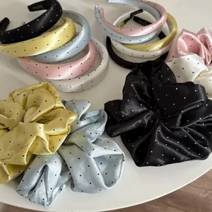 Polished satin polka dot hairband and oversized scrunchie collection in soft pastel tones
