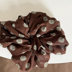 Brown chiffon polka dot scrunchie hair tie with elegant ribbon design for women