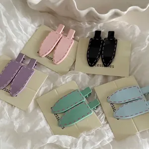 Sweet minimalist solid color hair clips set in five pastel shades on white fabric