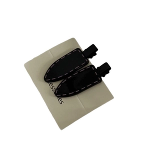Pair of sweet black teardrop hair clips with pink stitching on white display card
