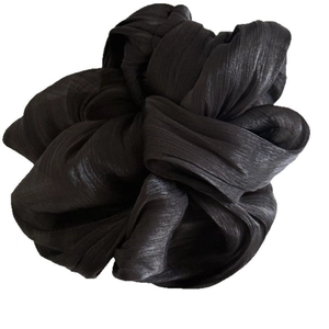 Elegant black pleated satin scrunchie with a lustrous silky texture for women hair