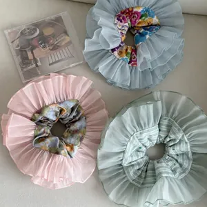 Three-piece organza scrunchies set in floral pink, mint green and light blue colors