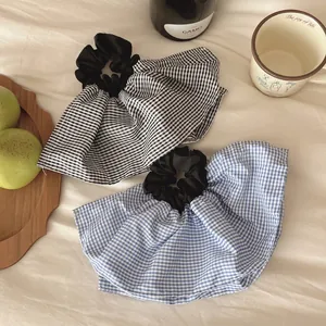 Elegant oversized plaid scrunchies in black and blue gingham pattern for women hair style