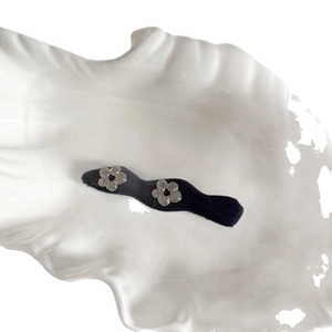 Chic silver floral hair clips with metallic mirror finish and minimalist denim fabric base