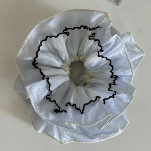 Handmade light blue double-layered lace scrunchie with brown wavy trim and white edging