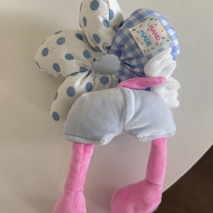 Cute blue checkered hair scrunchie with plush wings and pink legs in a creative design