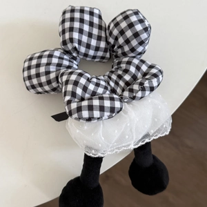 Close-up of cute floral scrunchie with black white checkers and white lace tutu detail