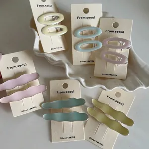 Elegant Korean pastel drip oil hair clips set in diverse shapes on a seashell tray