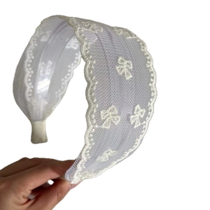 Elegant wide beige lace headband with delicate bow embroidery and scalloped edges for women