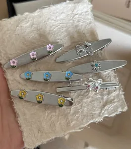 Set of six silver vintage floral hair clips with colorful enamel and crystal accents