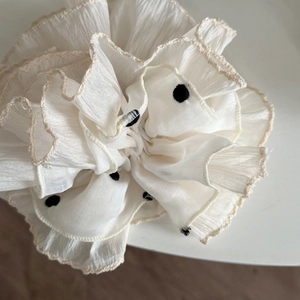 Double-layered beige polka dot scrunchie with chic yellow embroidery and ruffled edges
