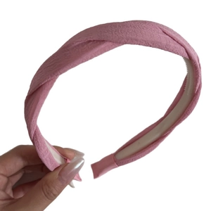 Pink braided fabric headband with twist design and non-slip inner teeth for women