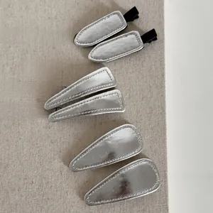 Silver PU leather hair clips set with minimalist triangular and geometric designs
