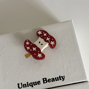 Sweet red apple hair clip with white stars and cream accents for women styling